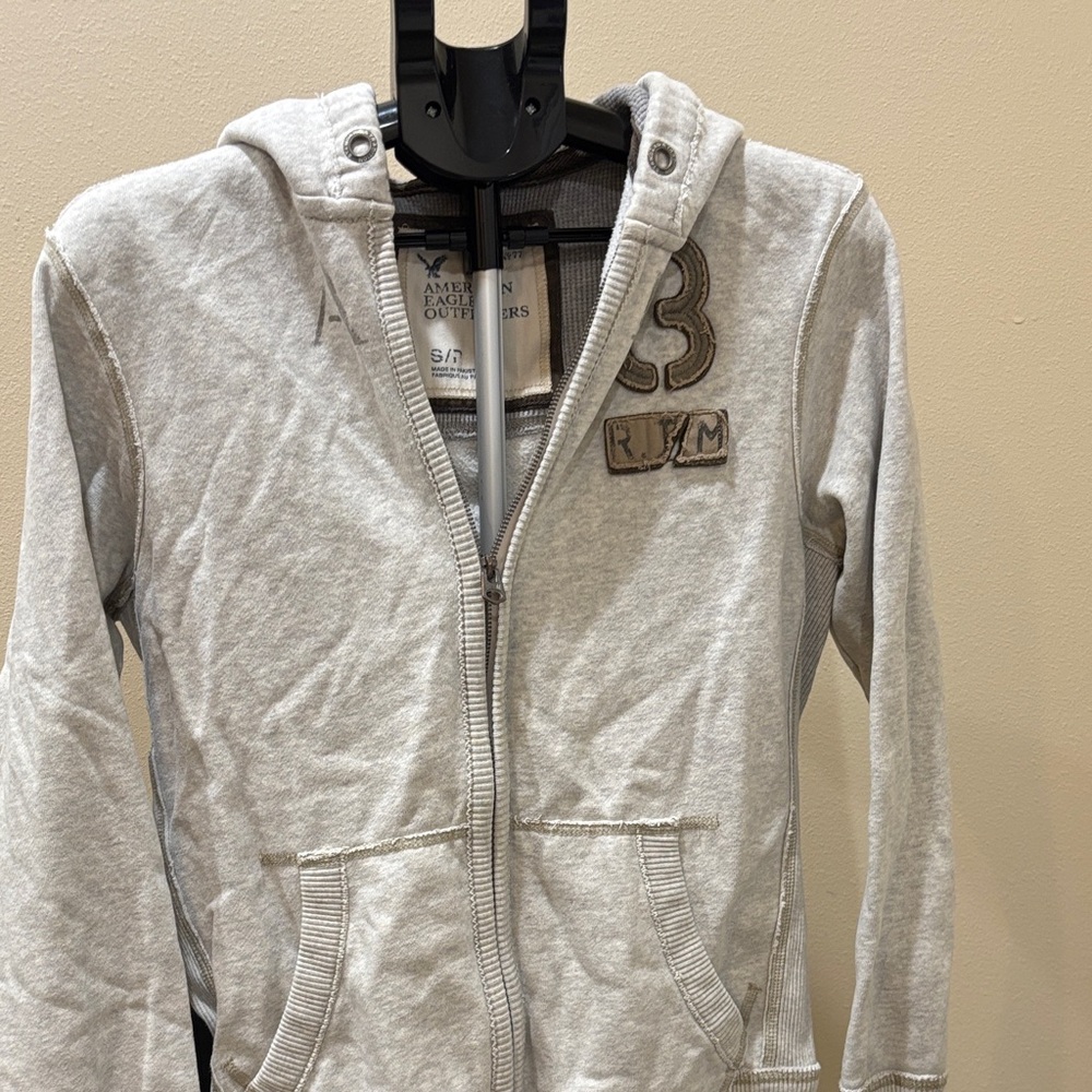 American Eagle Outfitters Light Gray Hoodie with Patch